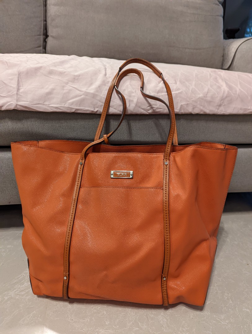 Tumi store orange bag