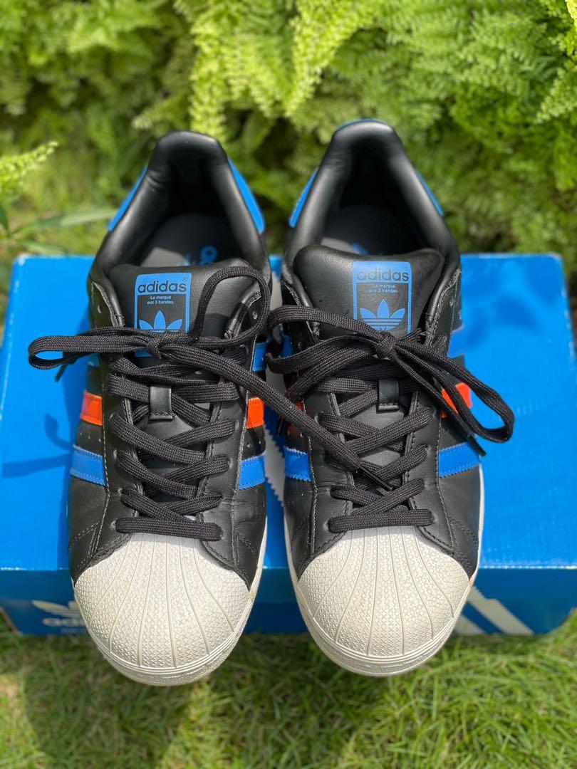 Superstar black with blue stripes online