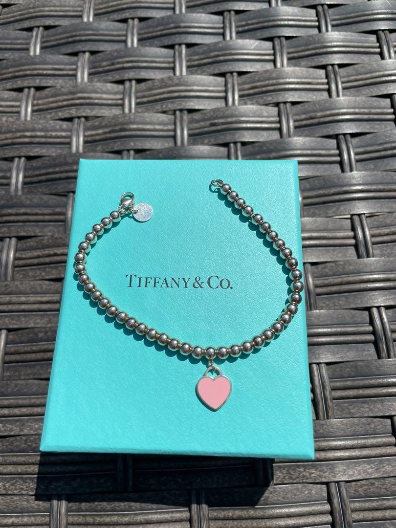 Return to Tiffany Heart Tag Bead Bracelet (Category: Jewelry) located in Toronto. Submitted by emdx_ (Listing ID 1172780782, Image 3). Description: Authentic return to tiffany pink heart enamel sterling silver bracelet Worn ONCE last year Has been left in the dust bag/box since Size small (6.5 inch) Original price $325 CAD Please msg before purchasing! .