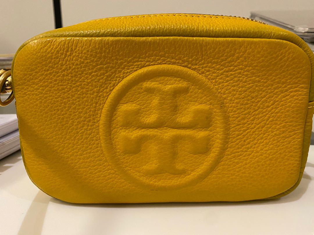 Tory Burch yellow sling purse (Category: Luxury Bags & Wallets) located in San Antonio. Submitted by champange101 (Listing ID 1172721956, Image 2). Description: Pls see photos for details. Used twice. Stored for 2 years, hence slight discoloration in zipper area..