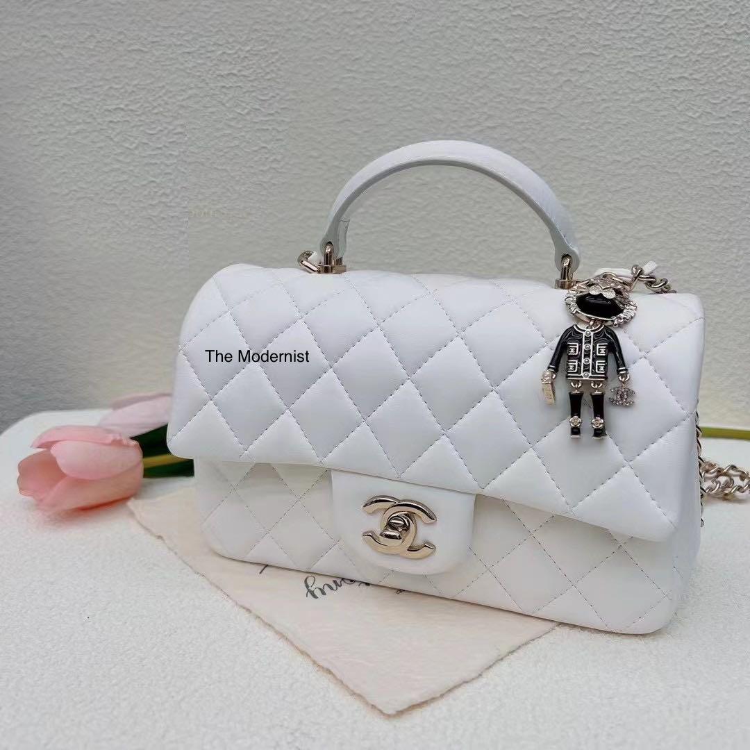 Authentic Chanel 22P Lion Charm Mini Flap Bag with Top Handle White Lambskin