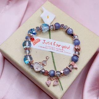 Blue Phoenix feather and bloodshot iolite bracelet