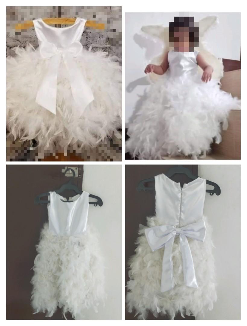 Customized feather baby gown (Category: Babies & Kids Fashion) located in Quezon City. Submitted by WizeSpender (Listing ID 1172817933, Image 1). Description: Used once during 1st bday Very light issue: may portion na need tahiin sa bandang may feather. ✨To achieve the balloon effect need to wear petticoat (not included) For sure buyers, can request for more pictures MOP: RCBC/GCASH SF c/o buyer Grab/Lalamove to be booked by the buyer.