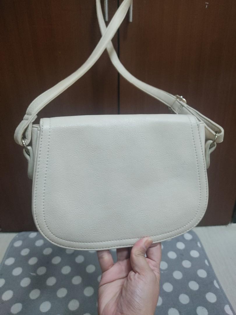 Cute shoulder bag (Category: Purses & Pouches) located in Manila. Submitted by ThatPinkInTheCorner (Listing ID 1172901255, Image 2). Description: Purchased in Japan. Used rarely but stored out of the closet. This is very cute and versatile. Actual color is off-white. Minimal issue shown in the picture. It can be glued or sewn. RFS: Decluttering Payment thru: GCASH Unionbank.