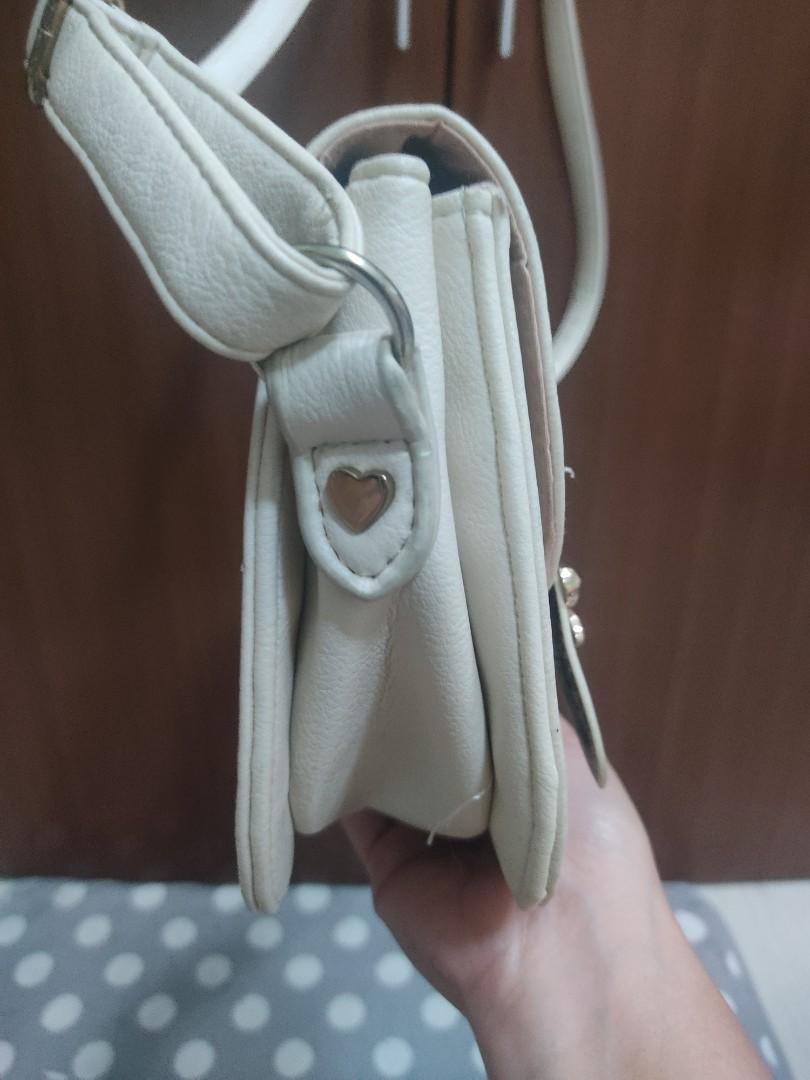 Cute shoulder bag (Category: Purses & Pouches) located in Manila. Submitted by ThatPinkInTheCorner (Listing ID 1172901255, Image 3). Description: Purchased in Japan. Used rarely but stored out of the closet. This is very cute and versatile. Actual color is off-white. Minimal issue shown in the picture. It can be glued or sewn. RFS: Decluttering Payment thru: GCASH Unionbank.