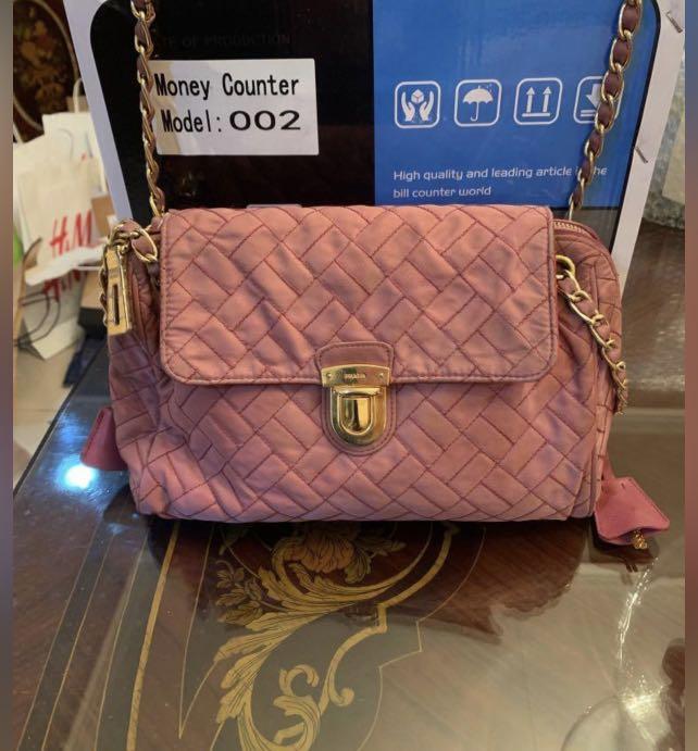 Prada Tessuto Saffiano Nylon Bag (Category: Luxury Bags & Wallets) located in Manila. Submitted by poeticallyinfamous (Listing ID 1172916004, Image 2). Description: Prada Tessuto Saffiano Pink Quilted Nylon Chain Shoulder Bag BR4965 💯Authentic Bag only Brand: Prada, BR4965, zip closure, interior zip pocket Material: Tessuto(Nylon) + Saffiano (Leather) Dimensions: 11”x5.5”x7”, Silver hardware .