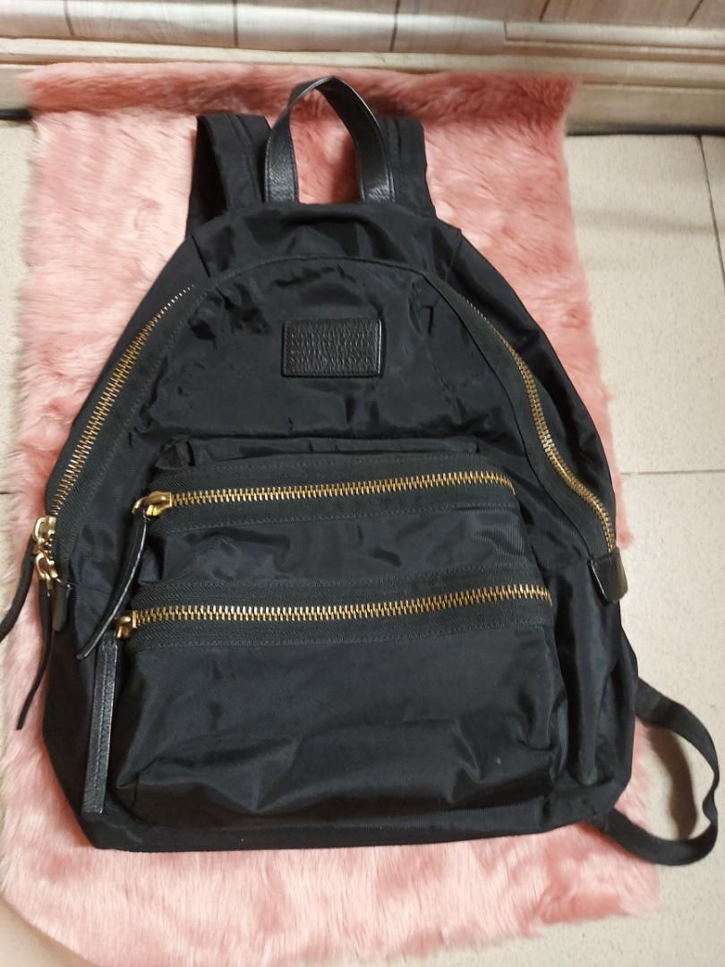 Preloved Marc Jacobs Biker BP (Category: Luxury Bags & Wallets) located in Quezon City. Submitted by yourlittleshop_yls (Listing ID 1172917713, Image 2). Description: Preloved 100% authentic Marc Jacobs Bagpack nylon body / cow leather on trimmings Nylon Biker bagpack; Condition As seen in the photos flaws inside but still usable.