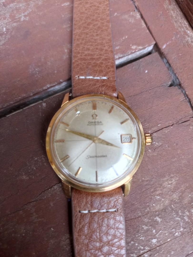 Vintage Omega Seamaster (Category: Precious Stones) located in Davao. Submitted by papa1919 (Listing ID 1006039115, Image 3). Description: - Vintage, circa 1960s. - Automatic self-winding. - 36mm case excluding crown. - Authentic crosshair champaign dial (not professionally refinished). - Unbuffed case with minor scratches consistent with age. - Crown has been replaced but with an era appropriate original Omega crown. - Will come with a brand new