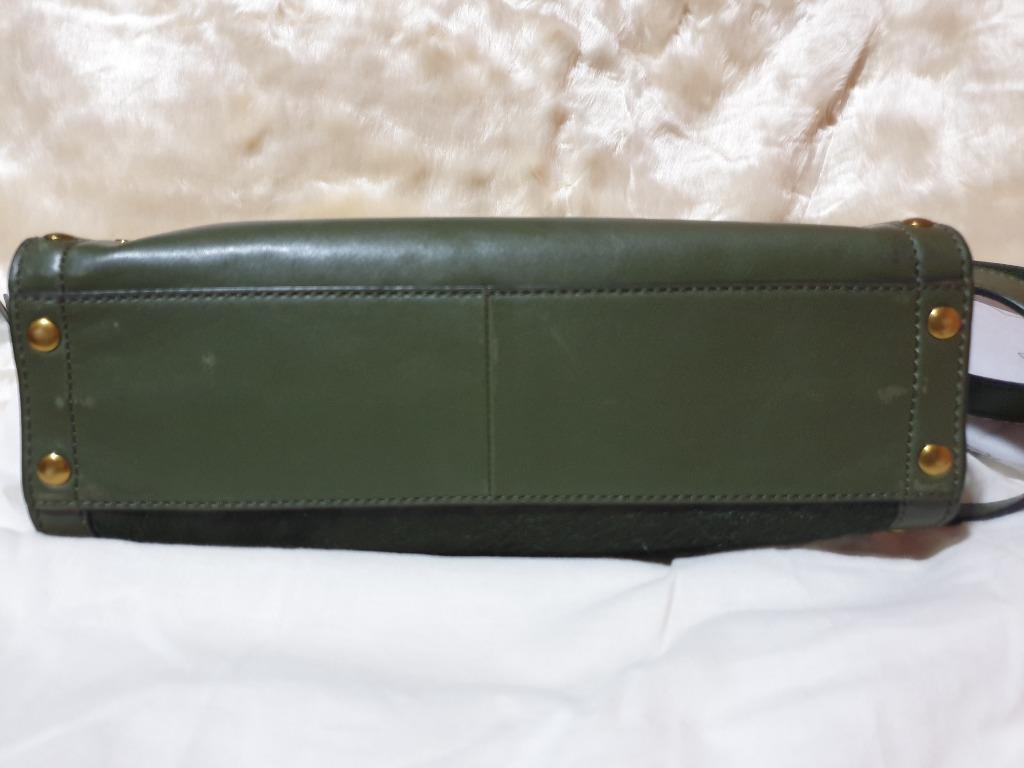 Authentic Fossil Green Leather Satchel Bag (Category: Shoulder Bags) located in Baguio. Submitted by formorecravings (Listing ID 1173363167, Image 3). Description: Authentic. Store bought 2021. Very soft calf hair leather in olive green Has a unique edgy look! With easy access pocket for the phone Has double straps. Gentle signs of use with slight rubs at the bottom but no defects. Clean inside out. Comes with dustbag, care card and receipt. Can 