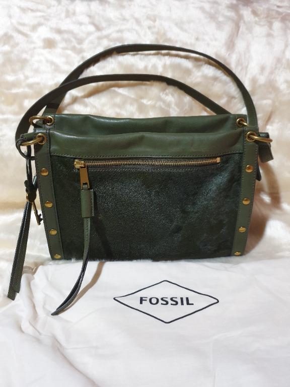 Authentic Fossil Green Leather Satchel Bag (Category: Shoulder Bags) located in Baguio. Submitted by formorecravings (Listing ID 1173363167, Image 1). Description: Authentic. Store bought 2021. Very soft calf hair leather in olive green Has a unique edgy look! With easy access pocket for the phone Has double straps. Gentle signs of use with slight rubs at the bottom but no defects. Clean inside out. Comes with dustbag, care card and receipt. Can 