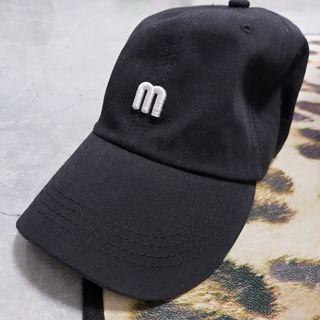 "M" cap