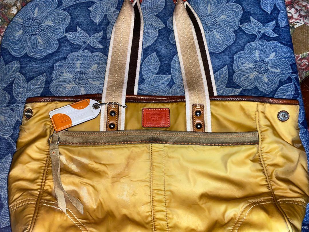 Authentic coach tote diaper bag (Category: Tote Bags) located in Pasig City. Submitted by rmark (Listing ID 1173930830, Image 2). Description: This bag is overall ok. The interior is very good. Some parts are sticky but not gluey. The leather on the lips of the bag have some cracking but does not affect the appearance of the bag.