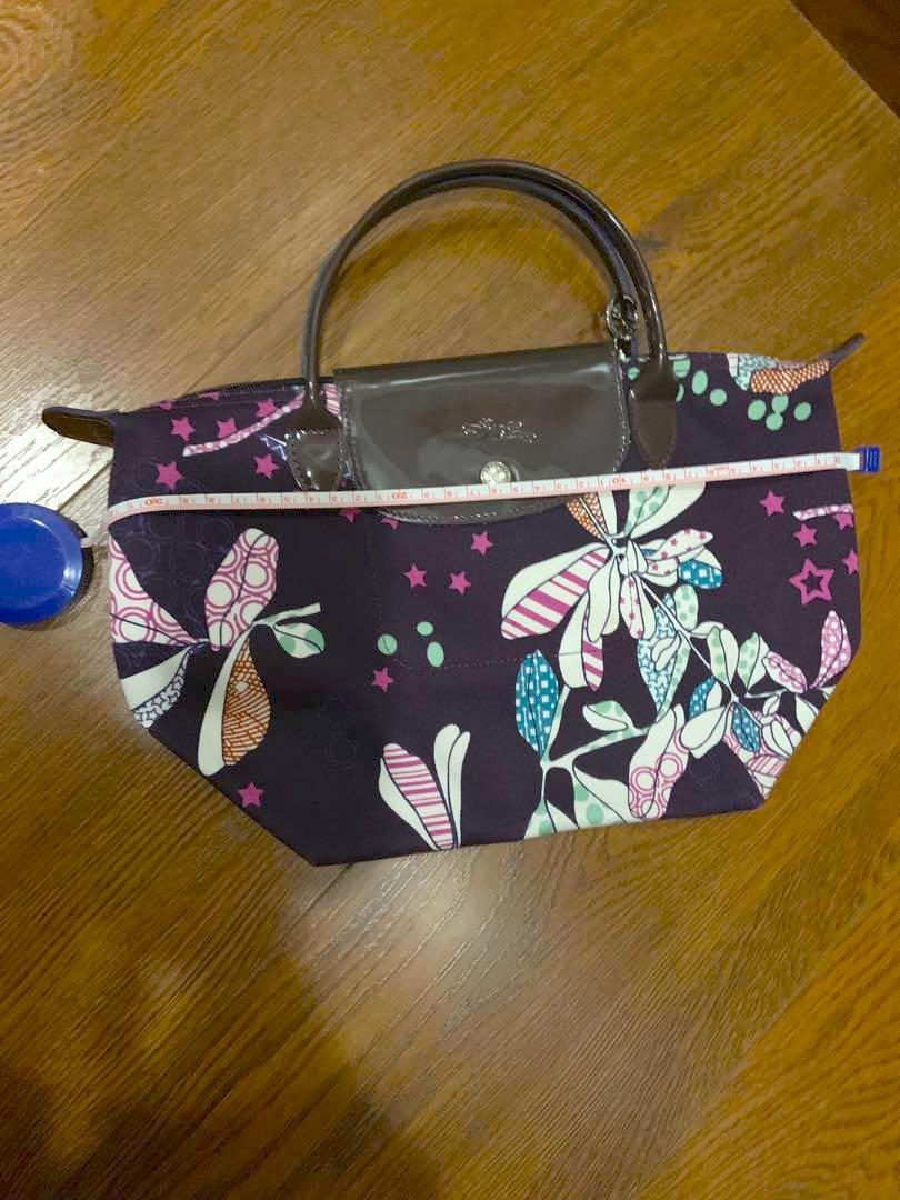 Authentic Purple Longchamp Mini Tote (Category: Tote Bags) located in Manila. Submitted by hflores_23 (Listing ID 1173277462, Image 2). Description: 100 💯 authentic. Personally bought in Paris. No flaws. Purple handles and prints. Rare design. Size indicated in photos. RFS: Decluttering Pls adopt! ❤️.