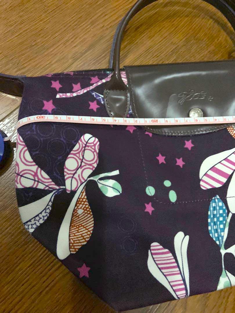 Authentic Purple Longchamp Mini Tote (Category: Tote Bags) located in Manila. Submitted by hflores_23 (Listing ID 1173277462, Image 3). Description: 100 💯 authentic. Personally bought in Paris. No flaws. Purple handles and prints. Rare design. Size indicated in photos. RFS: Decluttering Pls adopt! ❤️.