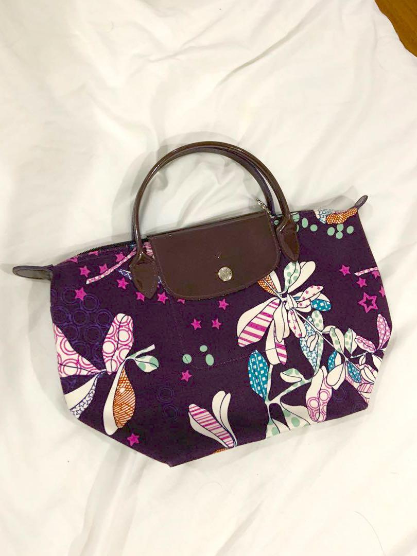 Authentic Purple Longchamp Mini Tote (Category: Tote Bags) located in Manila. Submitted by hflores_23 (Listing ID 1173277462, Image 1). Description: 100 💯 authentic. Personally bought in Paris. No flaws. Purple handles and prints. Rare design. Size indicated in photos. RFS: Decluttering Pls adopt! ❤️.
