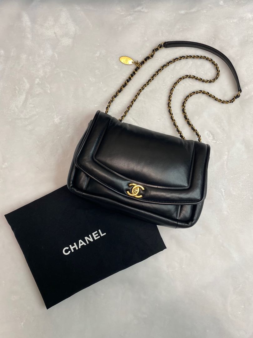 A fun and elegant accessory for day or night, this Chanel Vintage Puffy  Flap Bag Medium recalls vintage designs and will have you reaching…