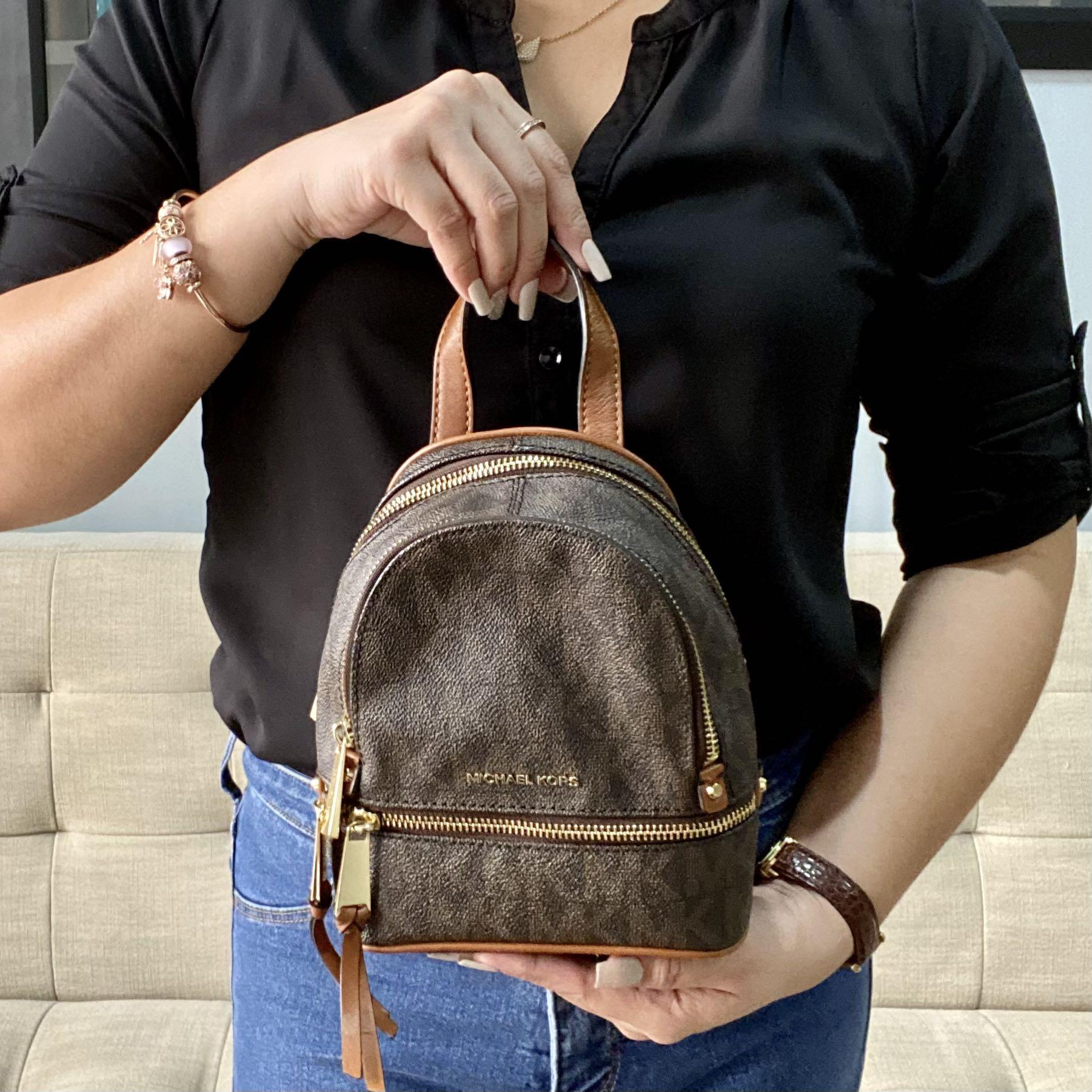 Michael Kors Mini Rhea Backpack, Luxury, Bags & Wallets on Carousell
