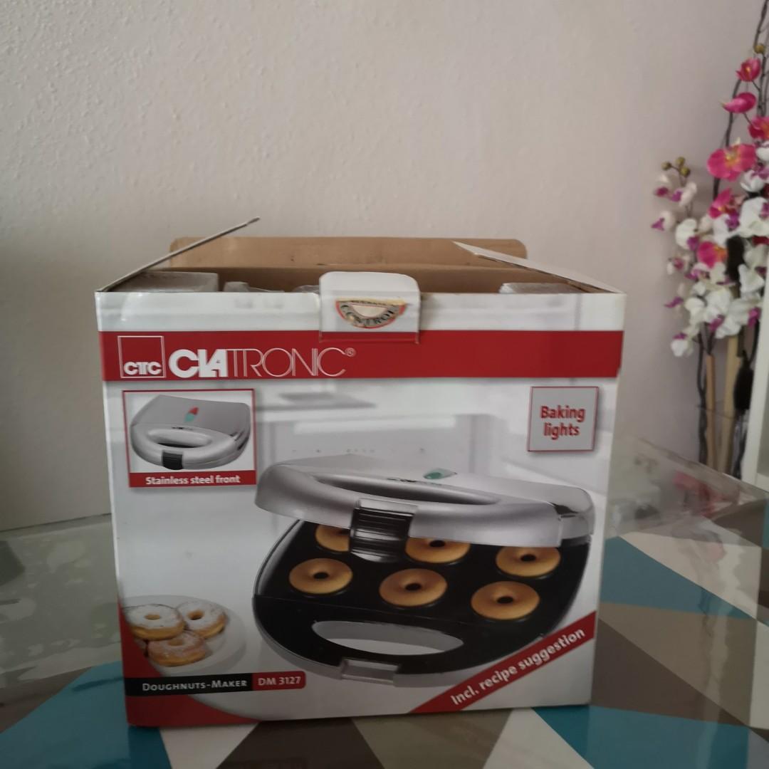 Doughnuts maker (Category: Ovens & Toasters) located in Singapore. Submitted by shopping_goodbuy (Listing ID 1173968708, Image 1). Description: This is a almost new item (maybe used only once) still with it's original box and packing. The item is purchased in Germany afew years ago and it came in an EU plug (2 pin plug) , voltage is same as SG. Self collect at my place at Bedok north Ave 1.