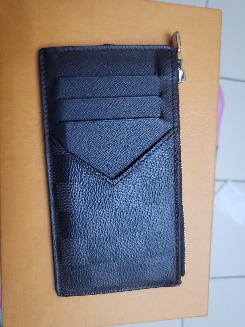 Authentic Louis Vuitton Damier Graphite Card and Coin Holder (Category: Luxury Bags & Wallets) located in Las Pinas. Submitted by tinrmt (Listing ID 1174296538, Image 2). Description: Like New Price Slightly Negotiable Complete with Box, Card and Paperbag Free Shipping.