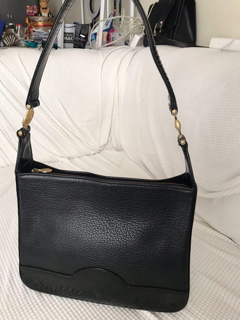 Authentic Versace Black Shoulder Bag (Neg.) (Category: Luxury Bags & Wallets) located in Pasig City. Submitted by markdangelo (Listing ID 1174223745, Image 3). Description: Authentic Versace Black Shoulder Bag *|** Negotiable DM 📩 for offers 😊👍💲 *Please read the description first before ordering/ buying. Once bought and shipped the item/s, it is considered sold. We do not accept return or exchange of item/s. **For security and peace of mind t