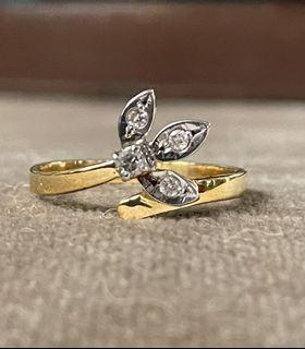 14 karat dainty flower 4-diamond crossover ring