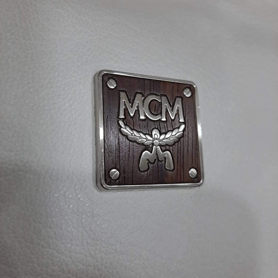 MCM Pochette Type Bag (Category: Luxury Bags & Wallets) located in Taguig. Submitted by esa.agustin (Listing ID 1174569316, Image 3). Description: Original MCM off white pvc leather pochette type bag. With provided puller. Made in Korea..