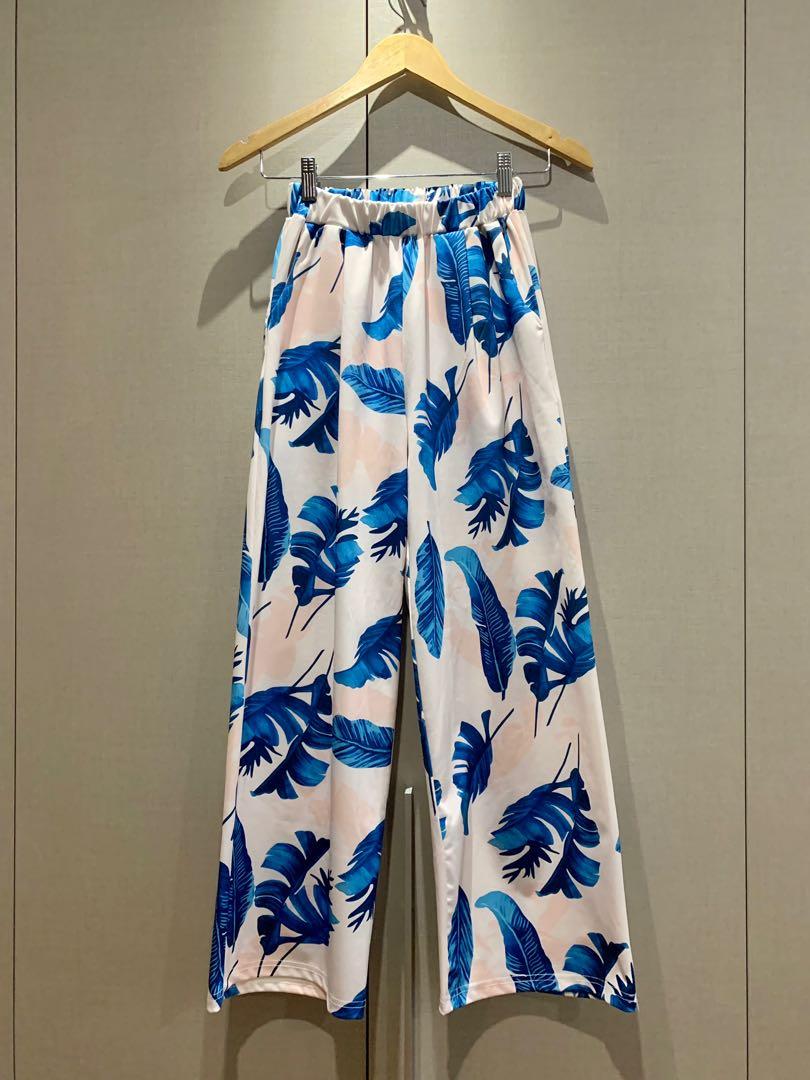 Tropical wide legged pants (Category: Other Bottoms) located in Mandaluyong City. Submitted by declutterila (Listing ID 1174517443, Image 1). Description: Light neoprene material, with blue, pink and white tropical pattern design. Garterized waist, Full length and has pockets. Can fit small to medium Worn once at a Hawaiian party. .