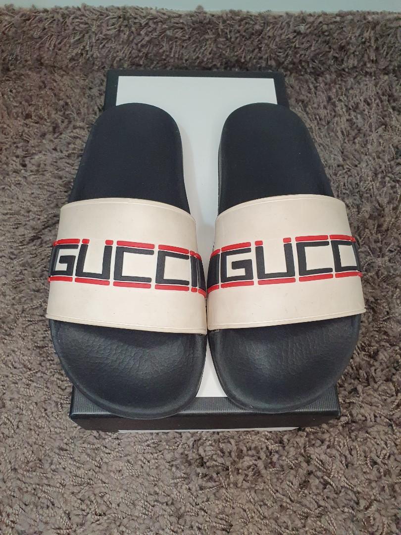 Gucci embossed slides on sale
