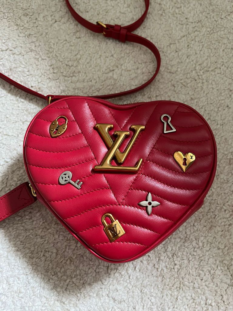 Louis Vuitton new wave heart shaped bag limited edition. Call 91018983