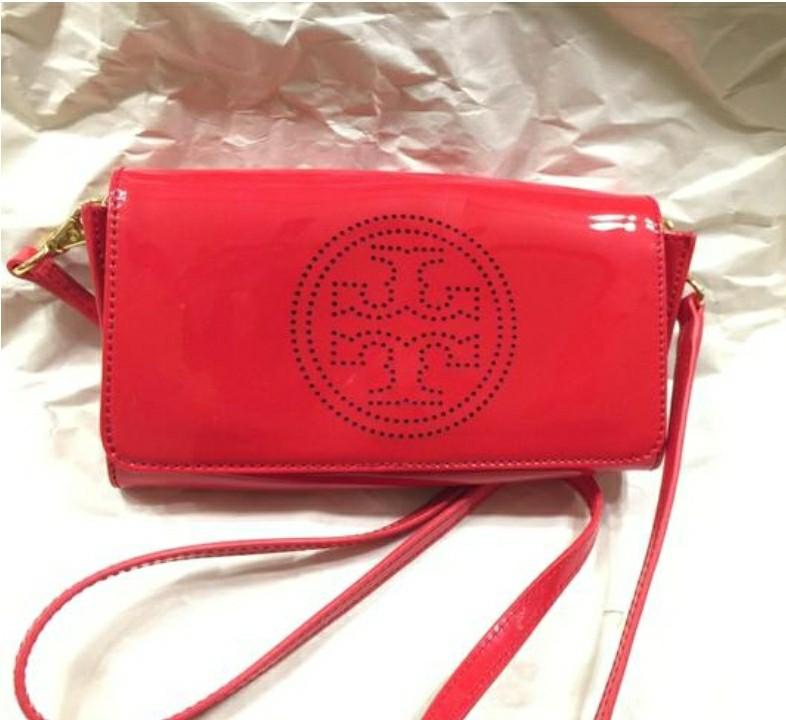 Tory Burch Perforated Logo Clutch Red Patent Leather, Luxury, Bags &  Wallets on Carousell