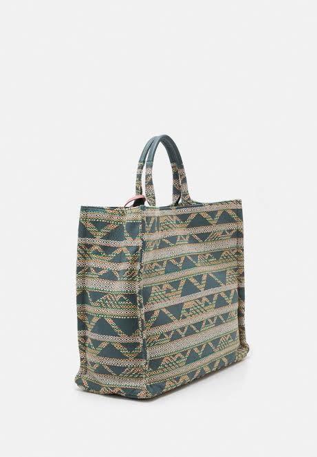 Coccinelle Never Without Bag / Jacquard Tote (Category: Luxury Bags & Wallets) located in Pasig City. Submitted by luxebagcray (Listing ID 1175083704, Image 1). Description: Super chic and roomy jacquard tote a la Dior Book Tote - great for casual style/beach/road trips Size medium - spacious without overwhelming small frames With bag tag and cards RFS: Spring cleaning Used only once! Still retails at 200+ USD so this is a steal.