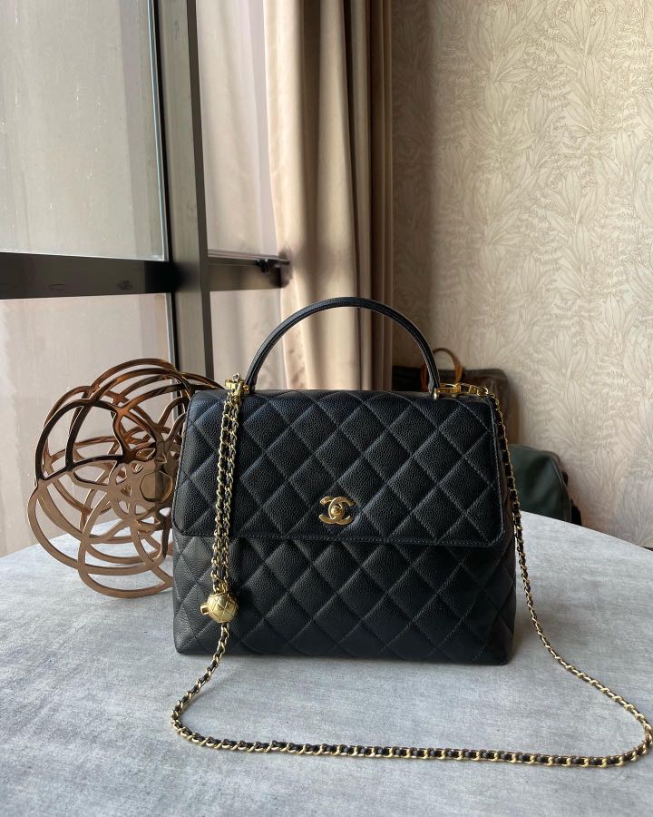 Maxi flap bag with top handle outlet