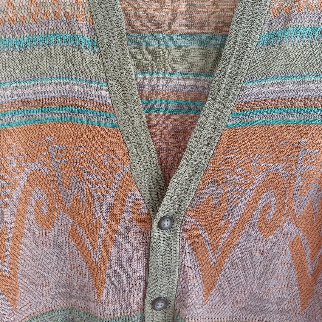 V-neck Green Sweater Vest (Category: Coats, Jackets and Outerwear) located in Angeles City. Submitted by greensstuff (Listing ID 1175283008, Image 3). Description: Has some loose threads as seen in pictures 5 and 6. DM for more info and sizing/measurements 😊.