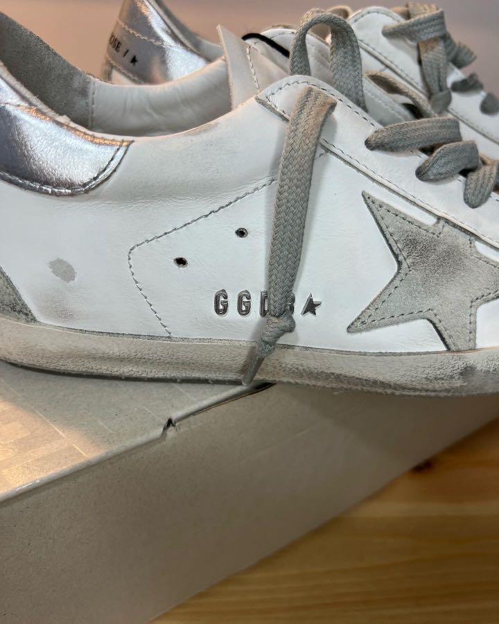 Golden Goose Women s Super Star sneakers with silver heel tab and metal stud lettering