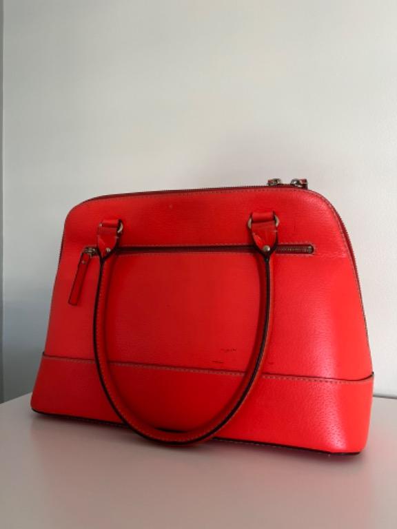 Orange Kate Spade Bag (Category: Luxury Bags & Wallets) located in Quezon City. Submitted by goldenfinds.ph (Listing ID 1170325612, Image 3). Description: Neon Orange Kate Spade Bag for sale! ₱4,500 (negotiable) - bought from the States - good condition - with dust bag - PM for measurements.