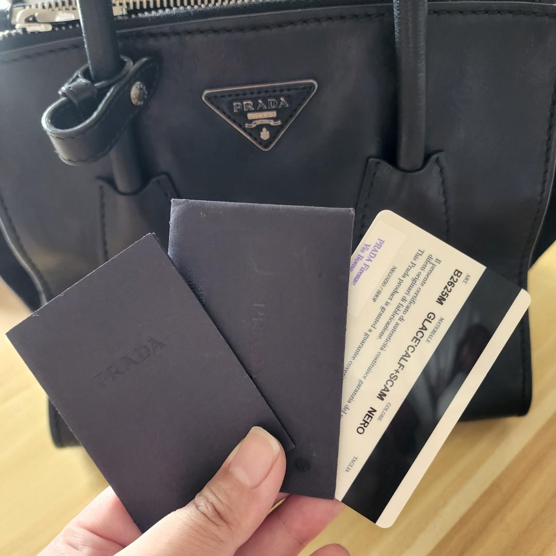 PRADA Black Glace Calf Leather & Suede (Category: Luxury Bags & Wallets) located in Quezon City. Submitted by paushhstore (Listing ID 1170372866, Image 2). Description: Hi! Selling also my well kept PRADA Black Glace Calf Leather & Suede Twin Pocket Double Handle Tote Bag B2625M DESCRIPTION Glacé calf leather tote Double leather handle Detachable adjustable shoulder strap Palladium-plated hardware Metal lettering logo on leather triangle Two outs