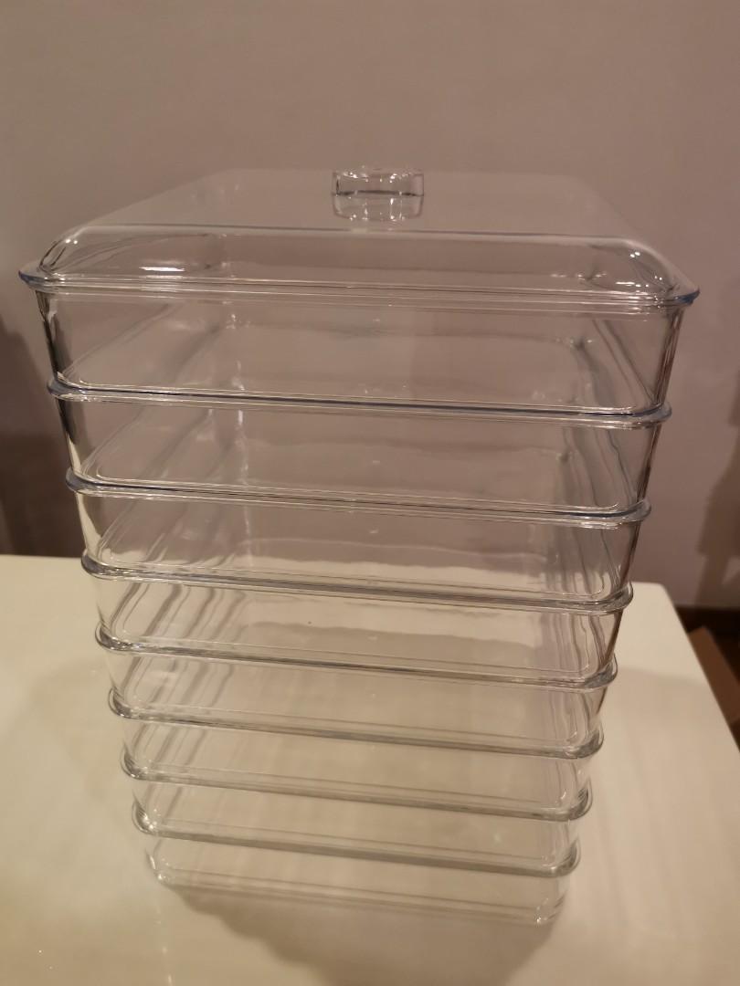 Stackable trays (Category: Food Organisation & Storage) located in Singapore. Submitted by jesteo333 (Listing ID 1170417092, Image 1). Description: Stackable plastic trays (x8). Total height is 32cm. Each tray is 21cm x 21cm x 4 cm (lxbxh).