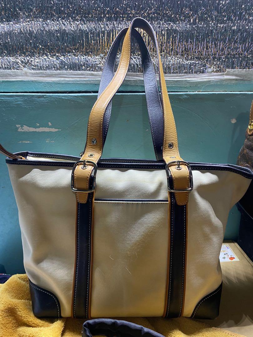 Sale! Authentic Original Coach two tone Bag (Category: Luxury Bags & Wallets) located in Pasig City. Submitted by rmark (Listing ID 1175526816, Image 2). Description: This needs to be dyed like a cream dye since the leather color bleeds. Overall, this bag is in good condition. Some rubs on the base Payment: Gcash.