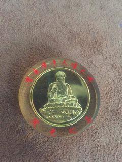 Buddha coin gold tone sealed