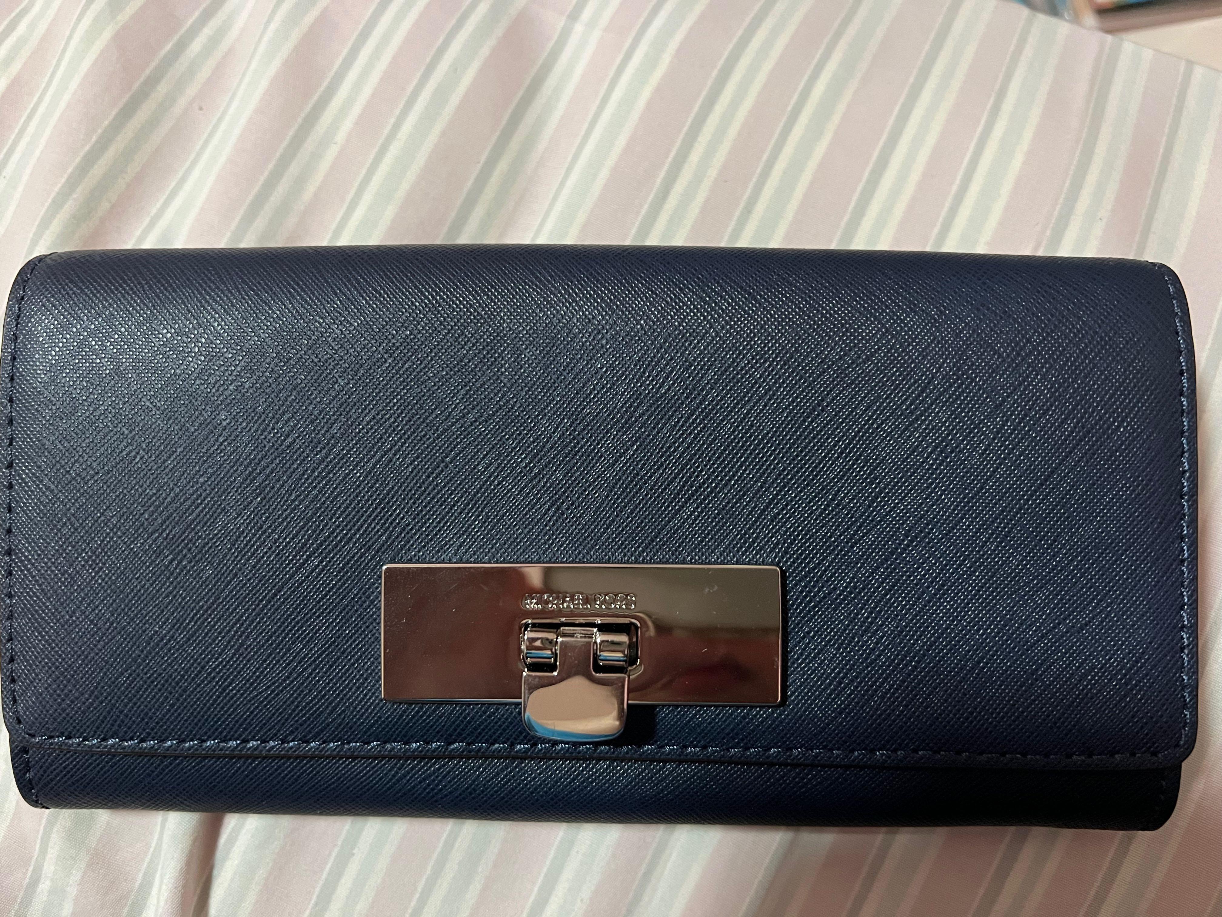 available onhand michael kors mk navy long wallet (Category: Wallets & Card holders) located in Quezon City. Submitted by second___life (Listing ID 1170650231, Image 1). Description: brand new never used some minor scratches on silver hardware lock Michael Kors navy long wallet no box given as a gift rfs: decluttering.
