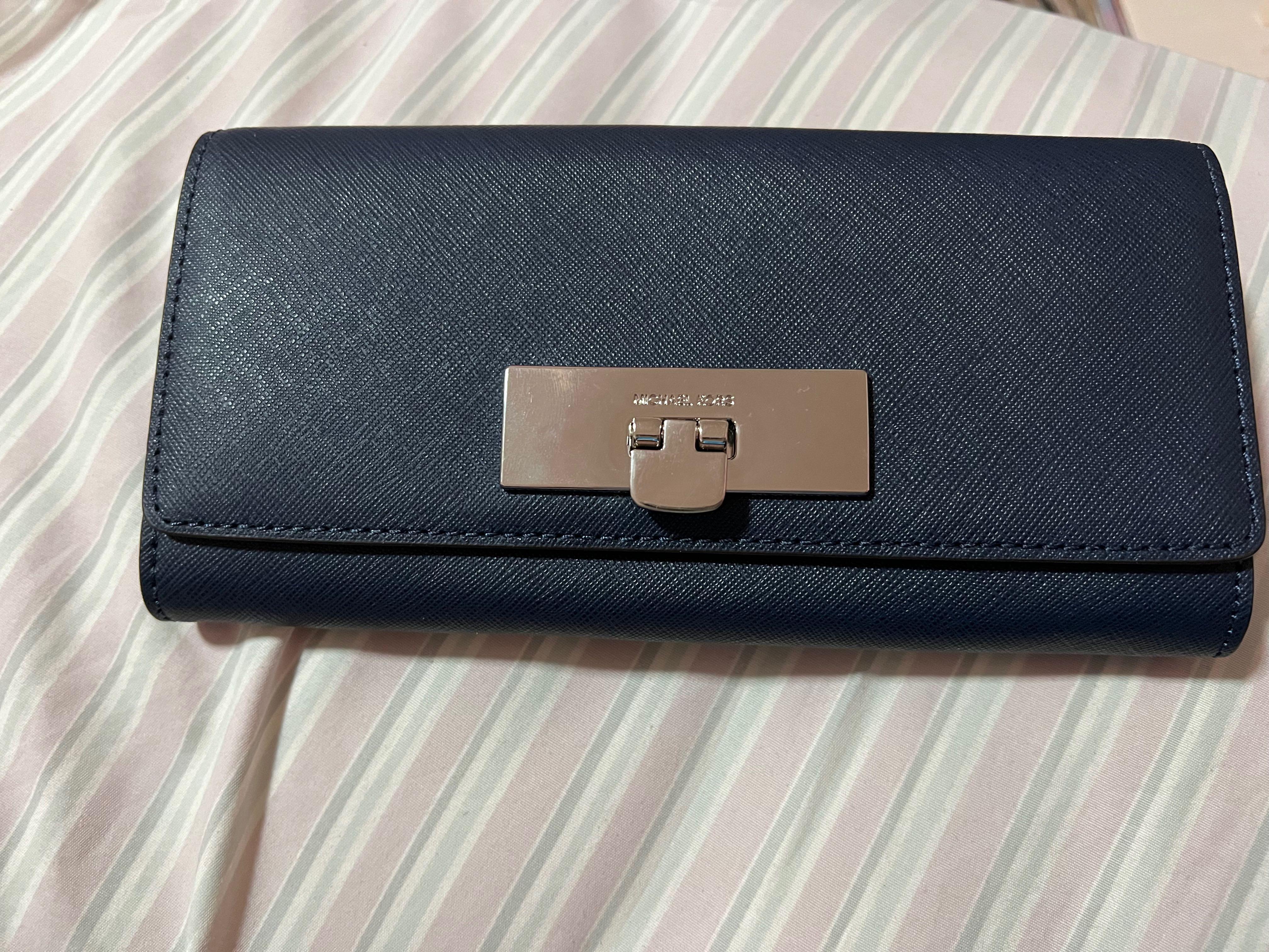 available onhand michael kors mk navy long wallet (Category: Wallets & Card holders) located in Quezon City. Submitted by second___life (Listing ID 1170650231, Image 2). Description: brand new never used some minor scratches on silver hardware lock Michael Kors navy long wallet no box given as a gift rfs: decluttering.