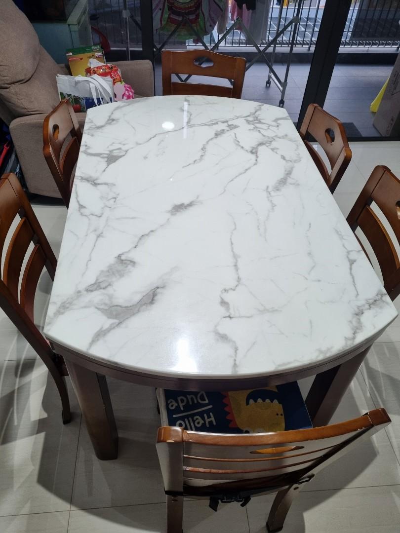Extendable Dining Table Set (Category: Tables & Sets) located in Singapore. Submitted by chfelicia (Listing ID 1170670101, Image 1). Description: Extendable from rectangle 35.5inch × 59inch to round 59 inch. comes with 6 chairs. in good working condition. Not for fussy buyer. Please note the table is heavy. You will need to dismantle legs before moving. For self collection from my home in punggol..