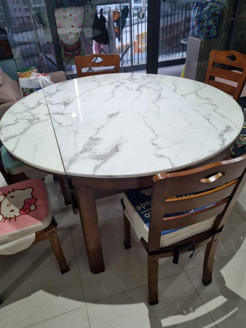 Extendable Dining Table Set (Category: Tables & Sets) located in Singapore. Submitted by chfelicia (Listing ID 1170670101, Image 2). Description: Extendable from rectangle 35.5inch × 59inch to round 59 inch. comes with 6 chairs. in good working condition. Not for fussy buyer. Please note the table is heavy. You will need to dismantle legs before moving. For self collection from my home in punggol..