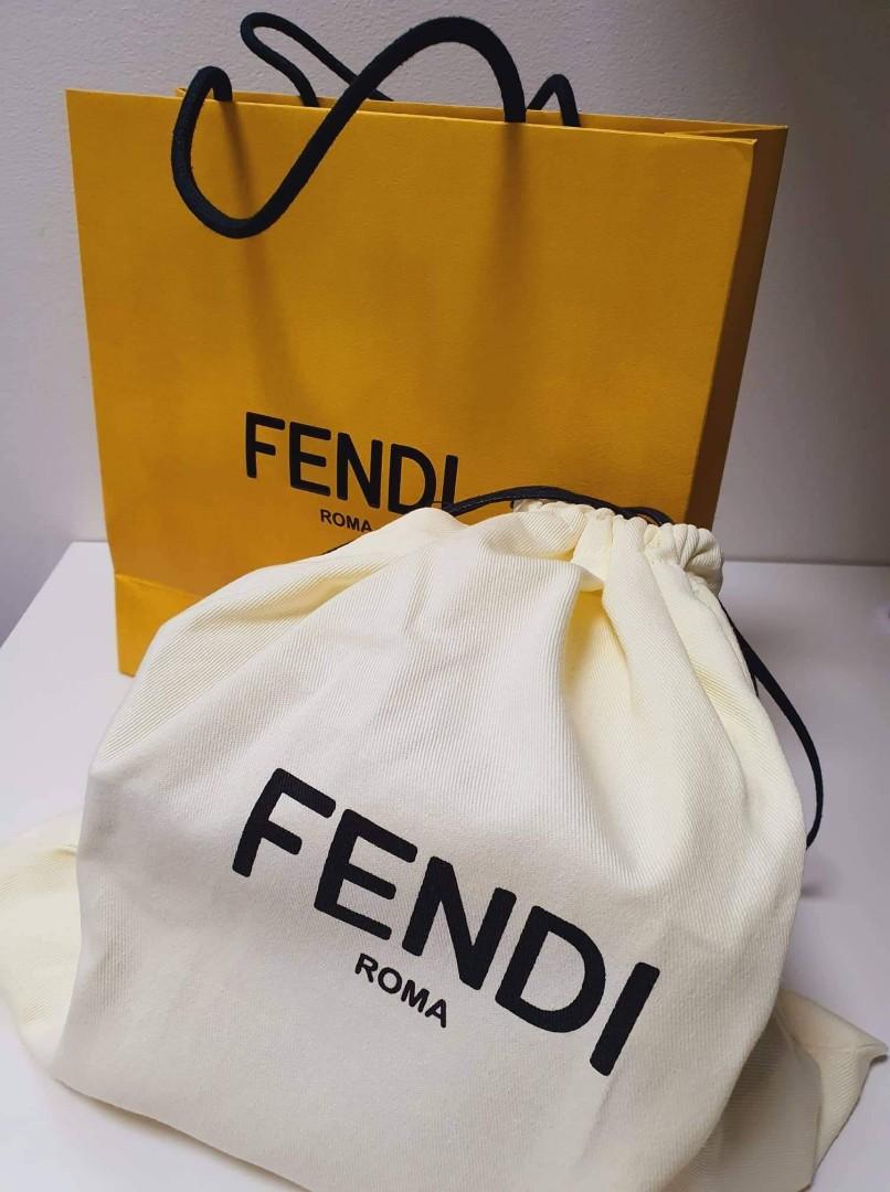 Authentic Fendi Bag (Category: Luxury Bags & Wallets) located in Manila. Submitted by danielatan (Listing ID 1170730893, Image 2). Description: Given as gift, with original cert and paper bag Rigid bag in a vertical design with magnetic clasp, made of wood and covered in pink leather with a black “FENDI ROMA” print. Palladium-finish metalware. The shoulder strap is adjustable and allows the bag to be worn over the shoulder or cross-body. Made in 