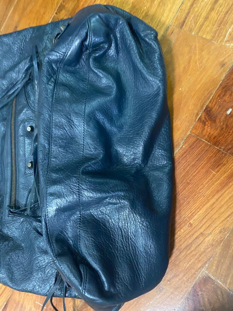 Balenciaga DAY hobo bag (Category: Luxury Bags & Wallets) located in Quezon City. Submitted by vintagekid (Listing ID 1170930165, Image 3). Description: Shoulder DAY bag from balenciaga Originally in YELLOW color and had it recolored to NAVY BLUE No peeling, in condition, only flaw (as seen in the photo) is the yellow color peeping at the back part. Minor recoloring needed..