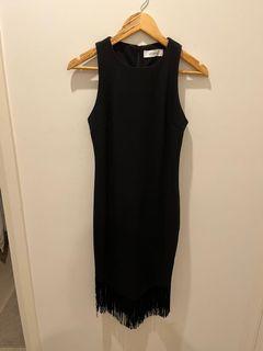 Black figure-hugging dress with frills