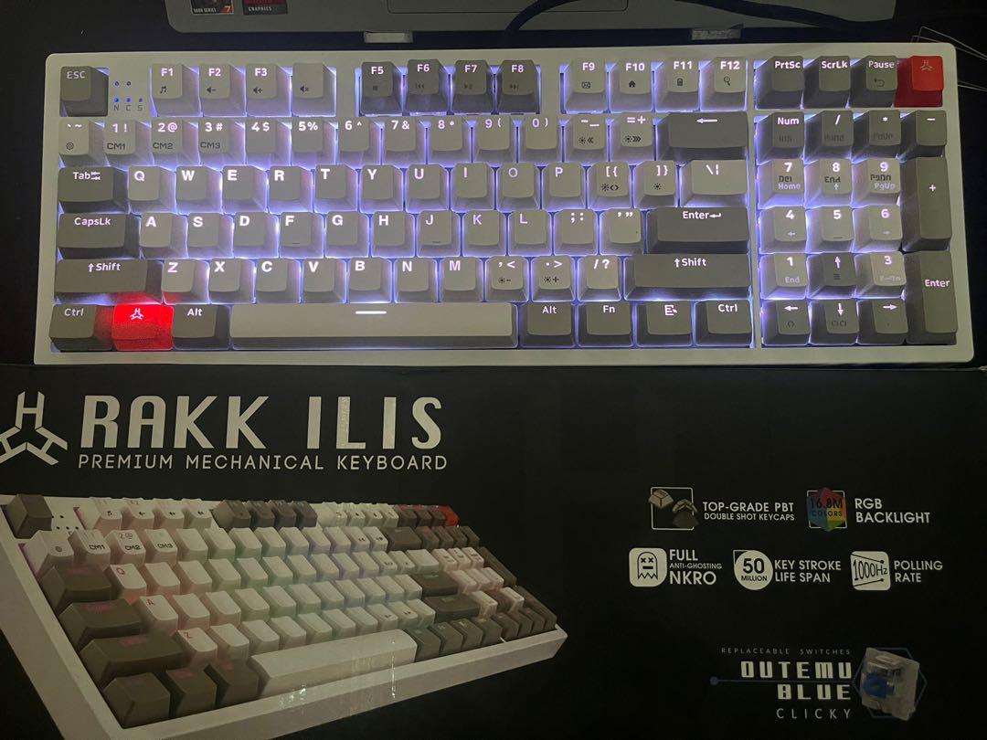 RAKK ILLIS (Category: Computer Keyboard) located in Manila. Submitted by tachipedia (Listing ID 1170922731, Image 1). Description: Rakk Illis 1500 Hot Swappable RGB Blue Switches With Original Keycaps and Extra Keycaps With White Side Cover With Box ALSO UP FOR TRADE.