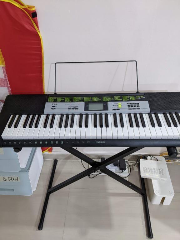 Casio LK 135 keyboard with stand and power adaptor