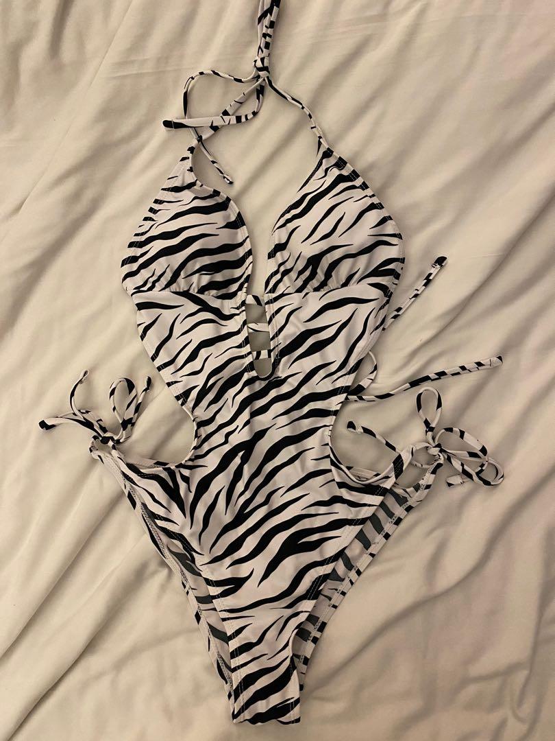Shein Zebra One Piece (Category: Bikinis & Swimsuits) located in Cebu City. Submitted by vanmags (Listing ID 1171129369, Image 1). Description: Good as brand new No flaws Stretchable Can fit up to Semi Large With surprise freebie if 5 items and up Rfs: decluttering .