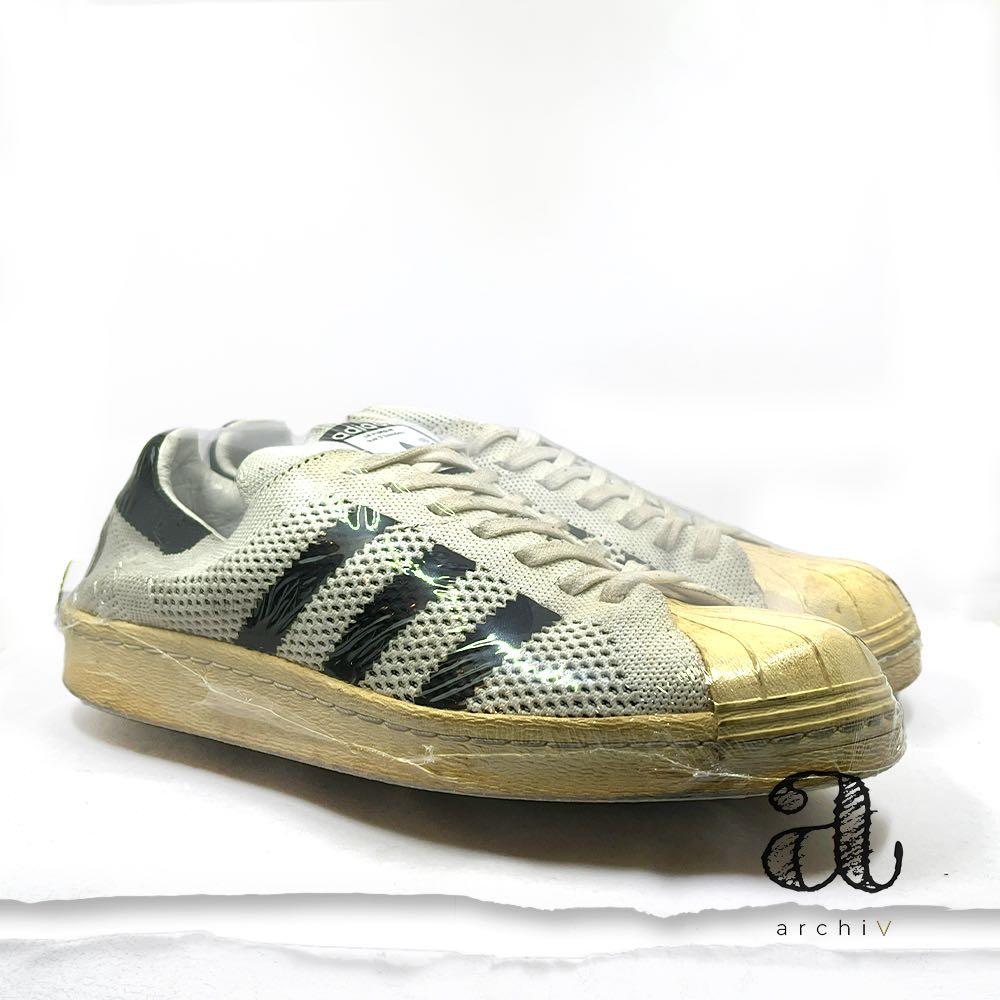 Adidas originals superstar hotsell primeknit mens gold